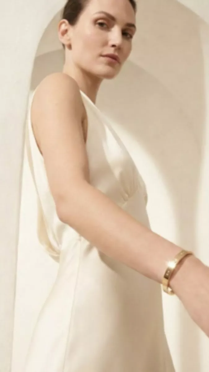 cartier necklace close editorial portrait warm neutral background luxury tone